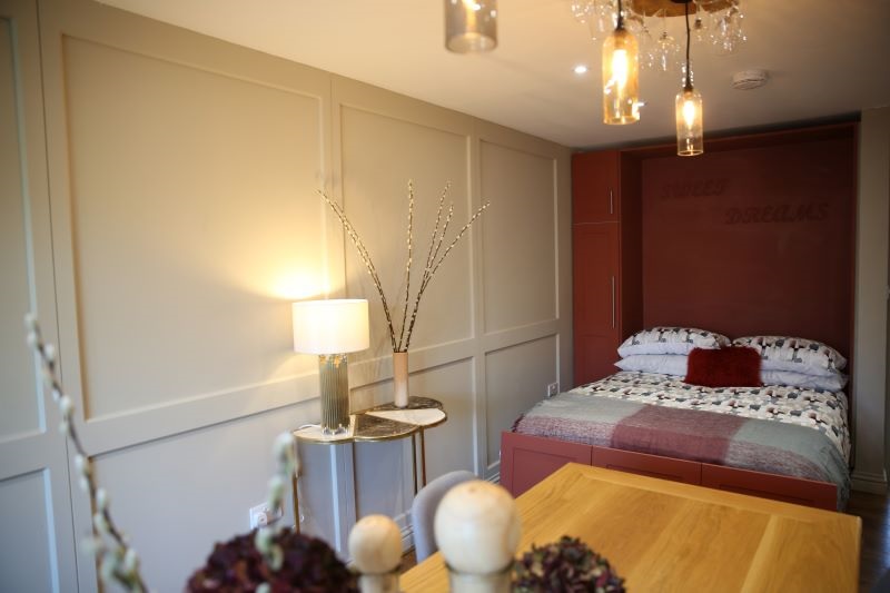 A Hideaway Wall Bed installed in a dining room during Renovate, Don’t Relocate